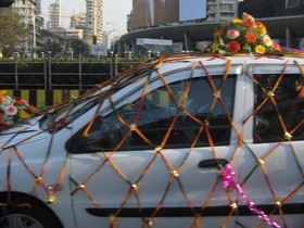 Fresh flowers and silk flowers make great wedding car decorations!