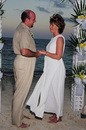 Jim and Lynnette's wedding ceremony - exchanging vows oceanside on Cable Beach in the Bahamas